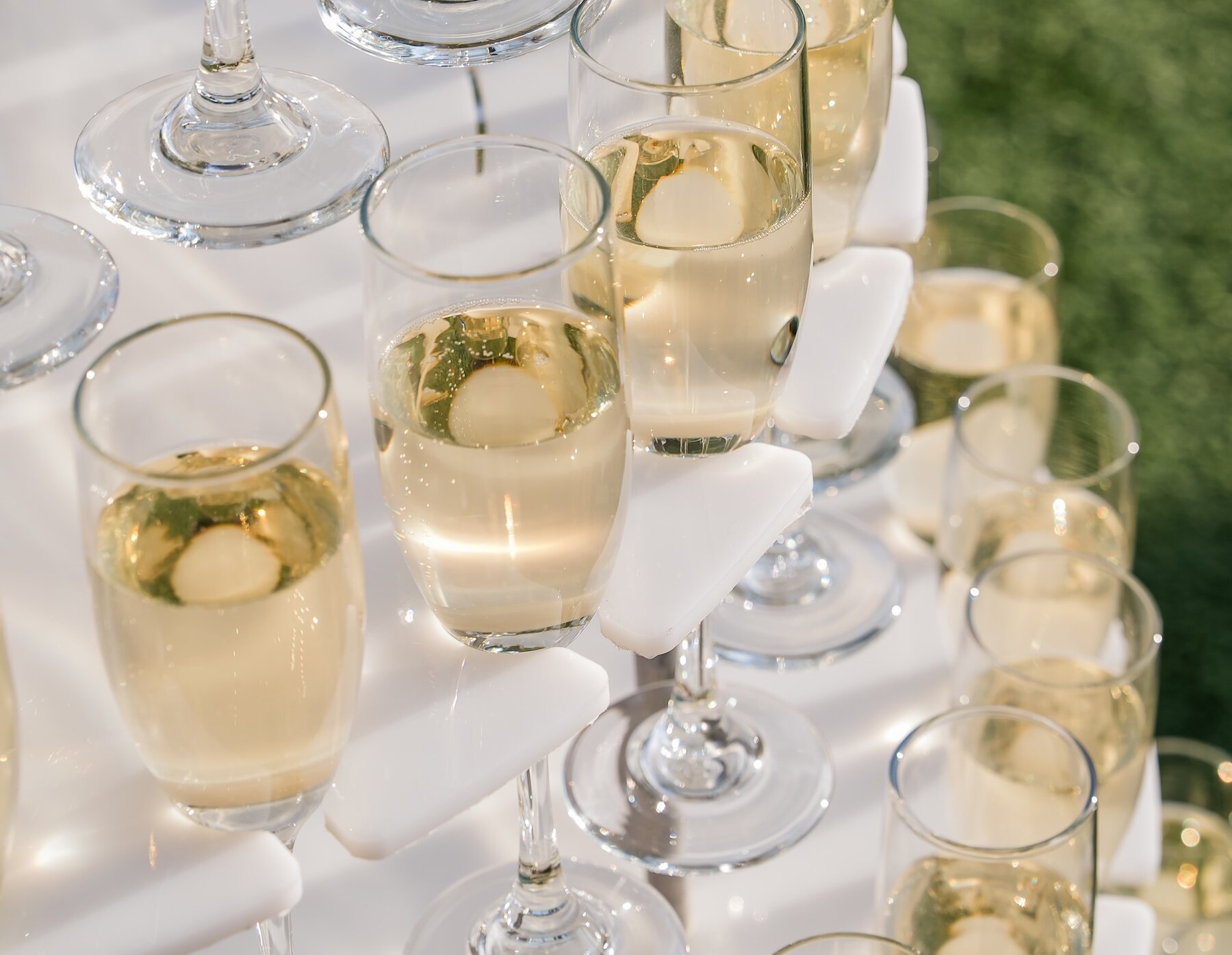 Tower of full champaign glasses ready to serve.