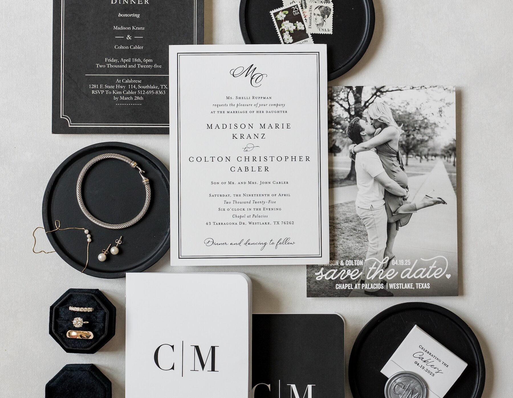 Wedding jewelry, stationary, and vow booklet flat spread