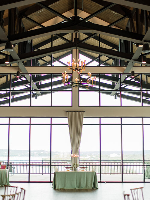 Reception ballroom with large windows overlooking Lake Travis