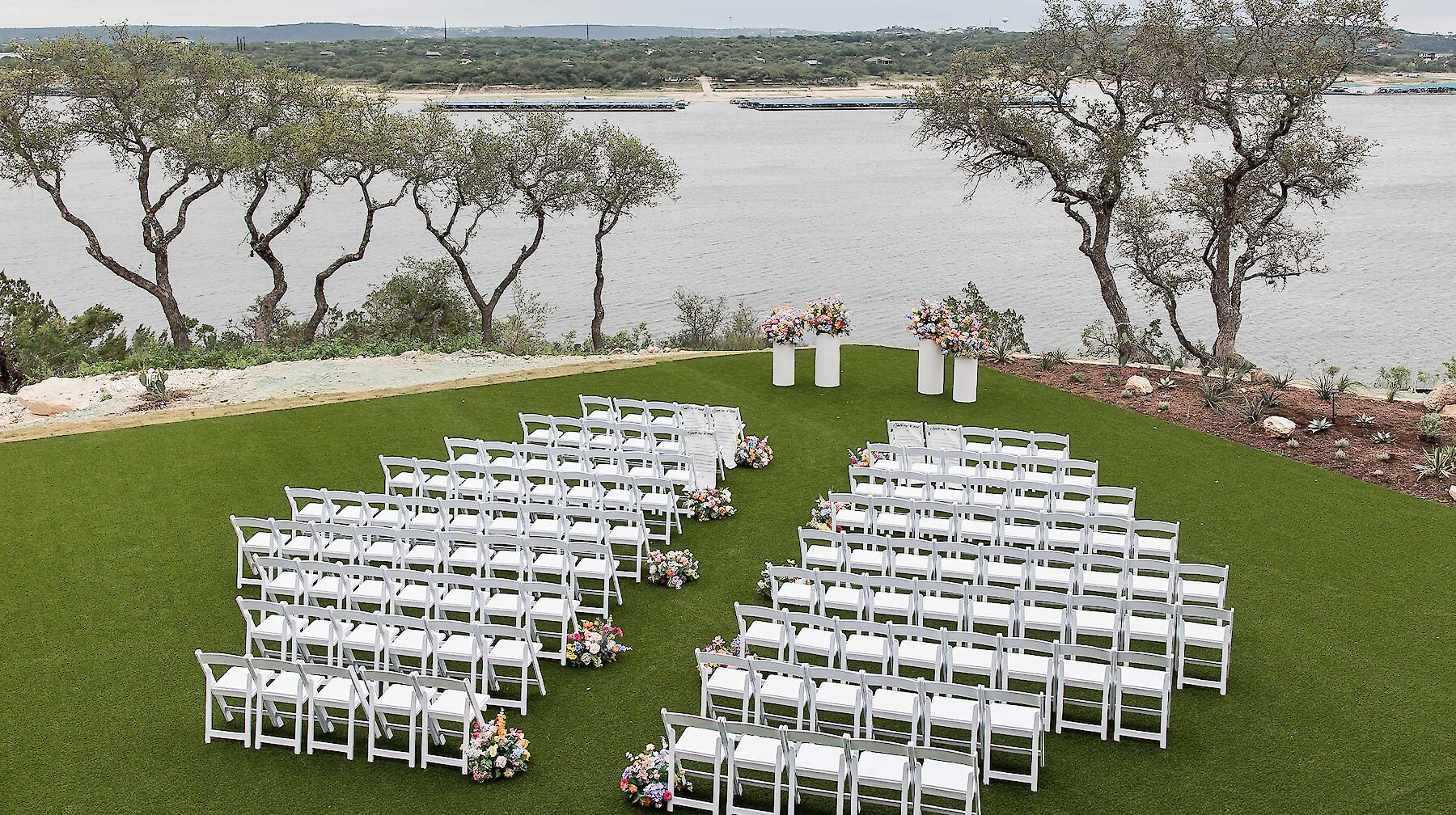 aerial view of a large outdoor ceremony overlooking lake travis