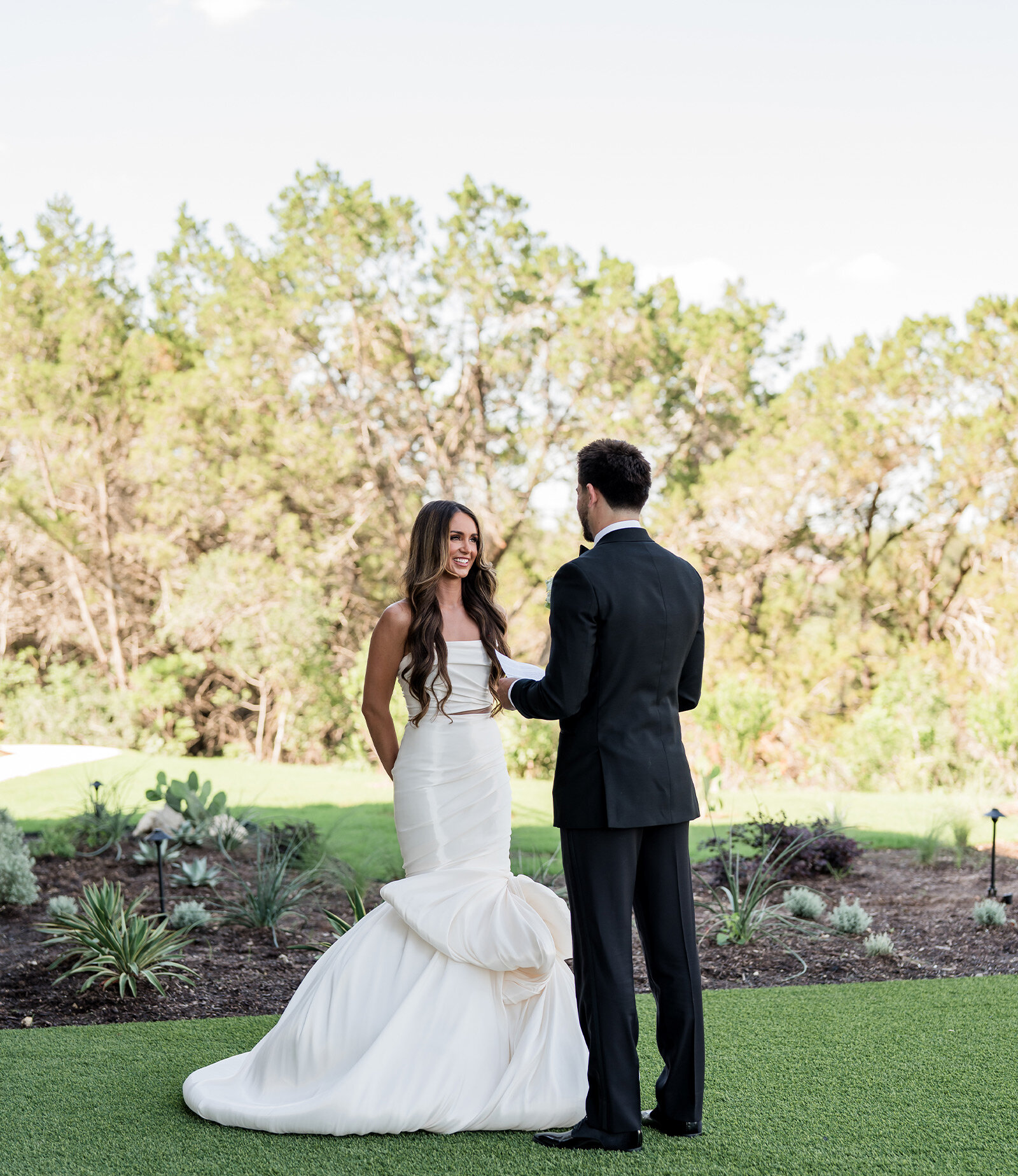 Bride and groom sharing a first look outside