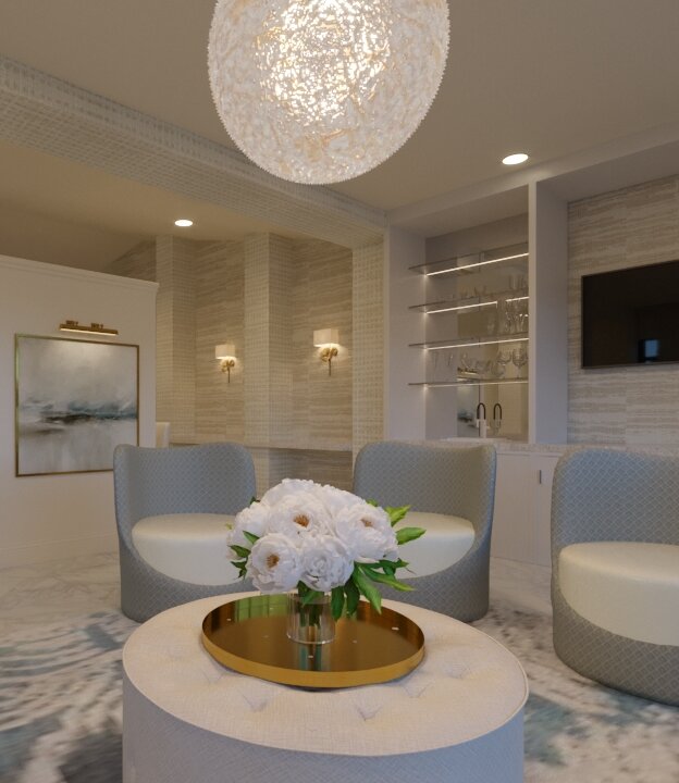 A luxury bridal suite featuring soft gray and white seating, a large circular light fixture, and a dressing area with clothes hanging in the background.
