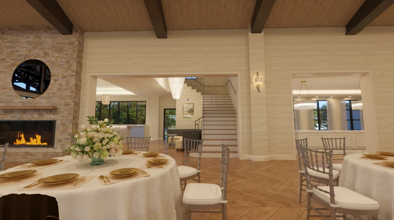 An interior rendering of a bright reception space featuring stone walls, a fireplace with a circular window, a staircase, and a wedding table set with gold plates.