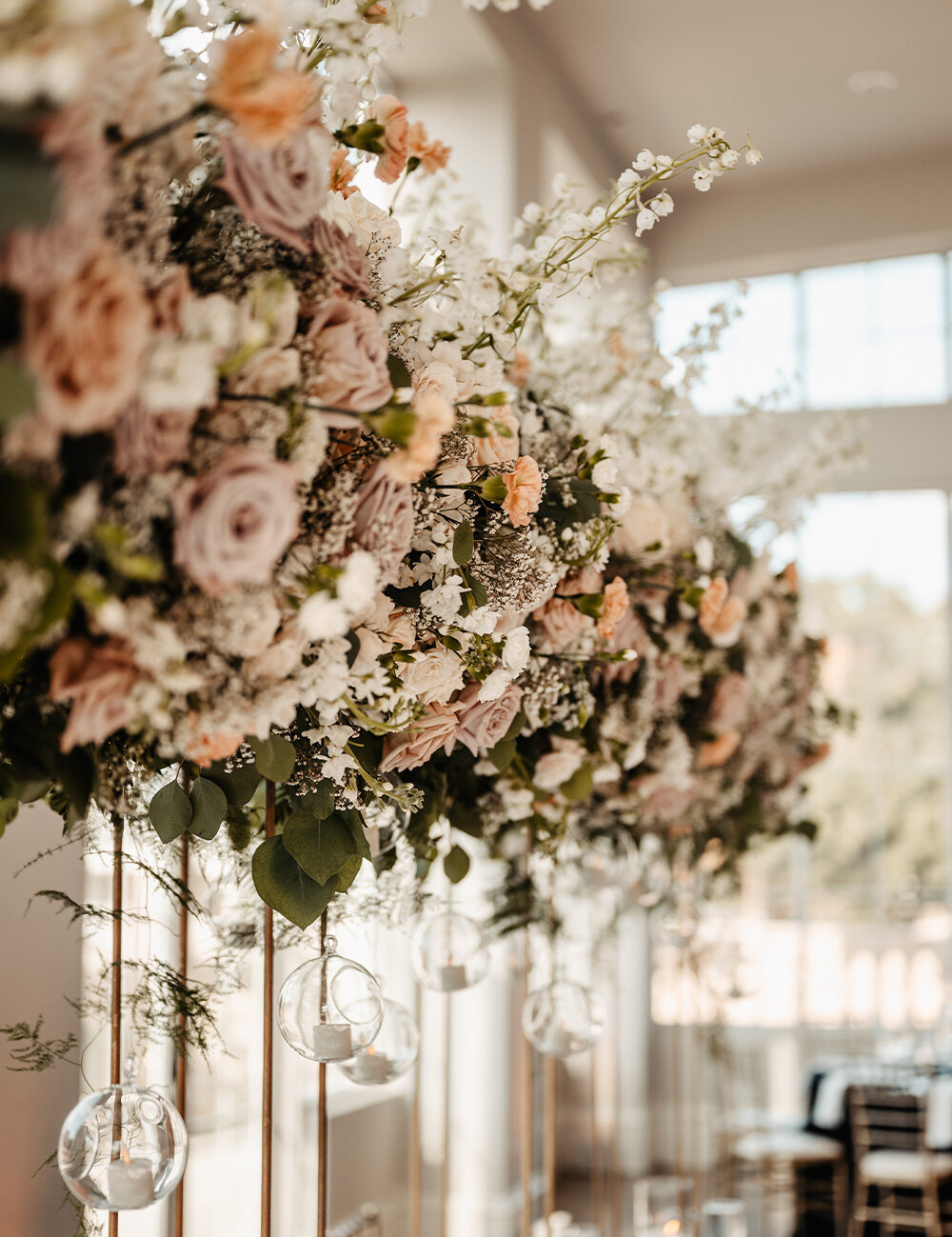 side view of blush and green florals for wedding