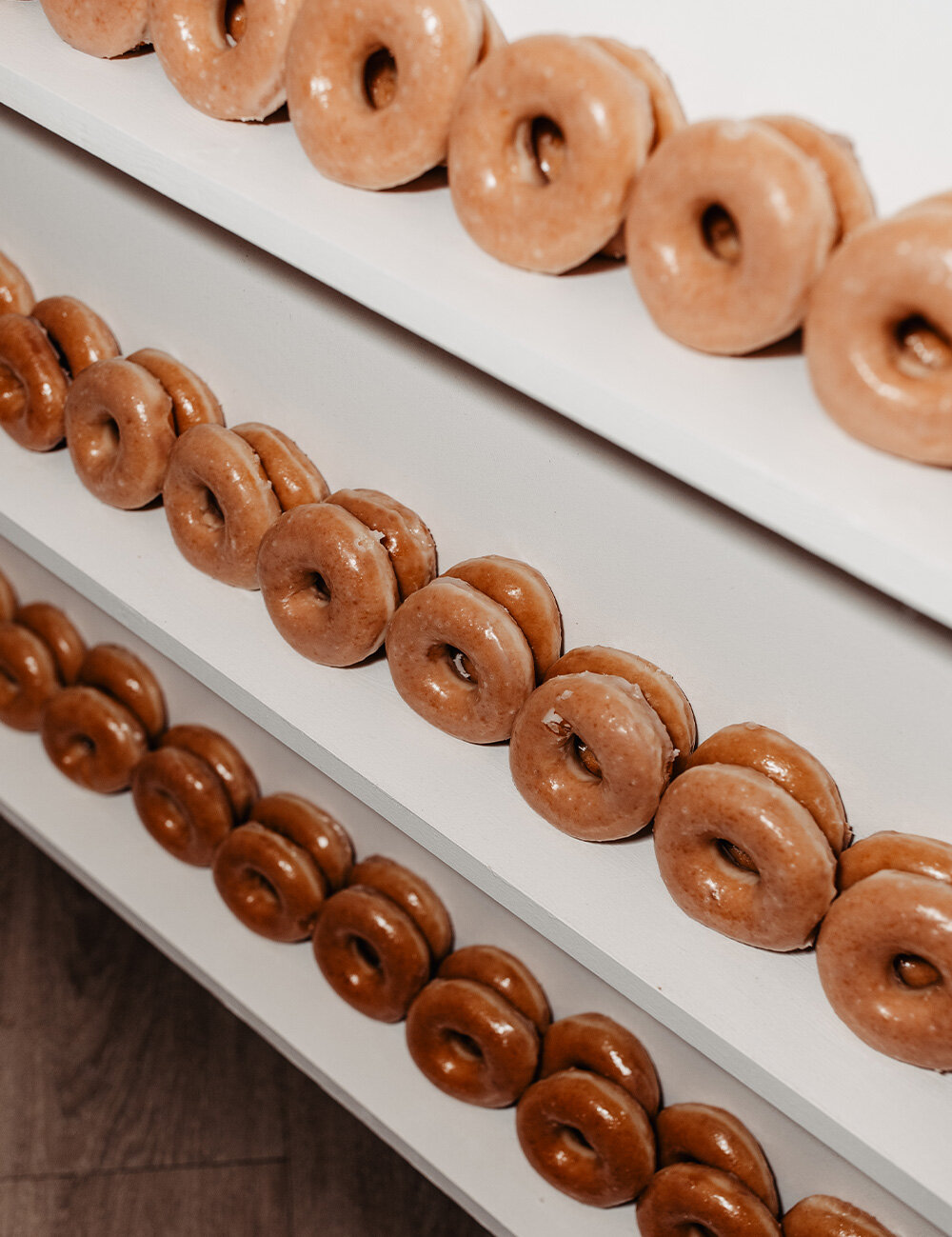 wall of different flavored donuts