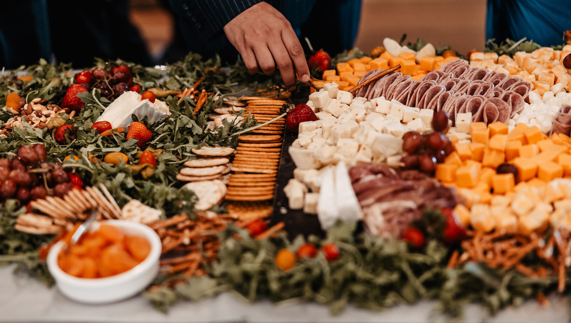 large grazing table of cheese and crackers