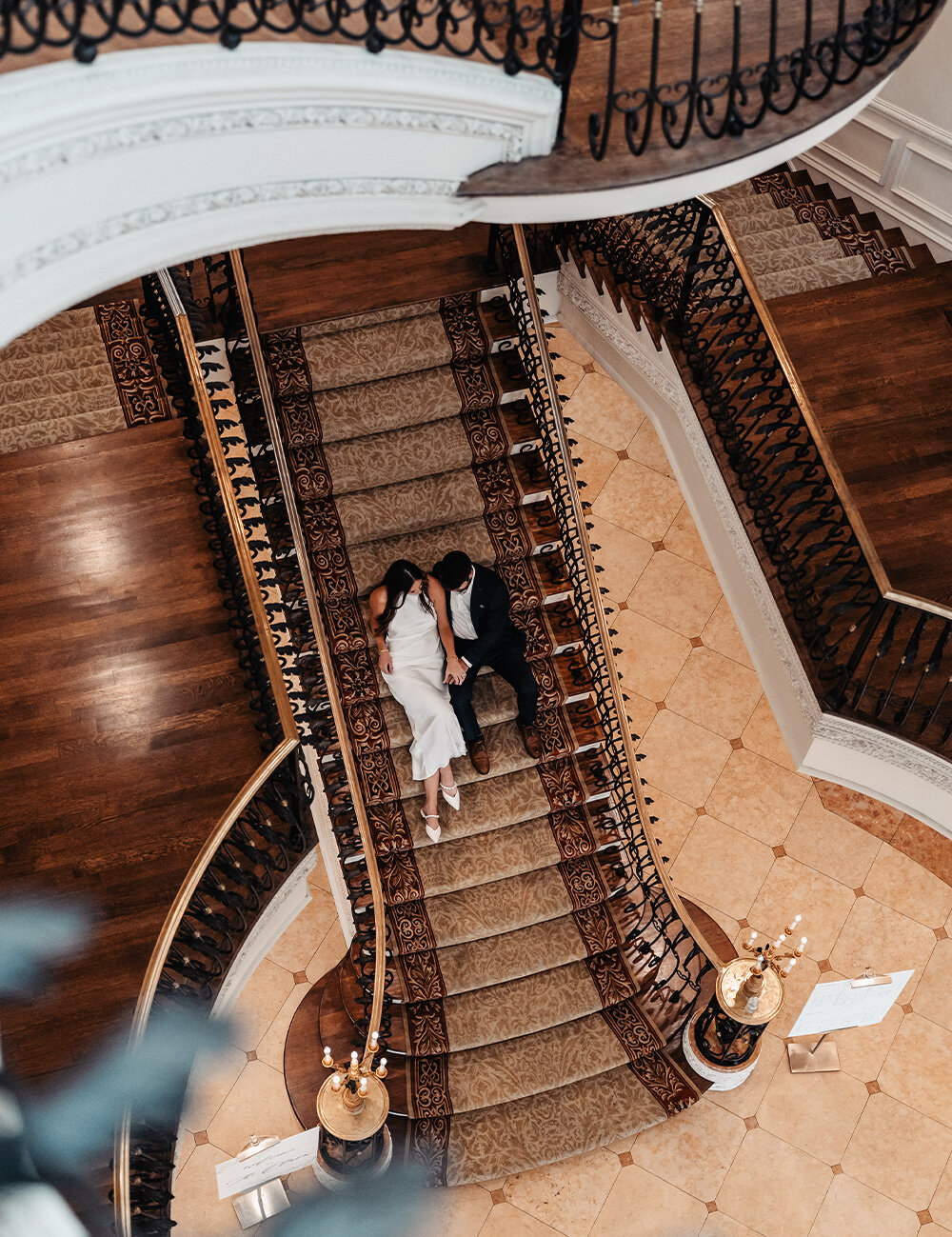couple sitting on wedding stairs