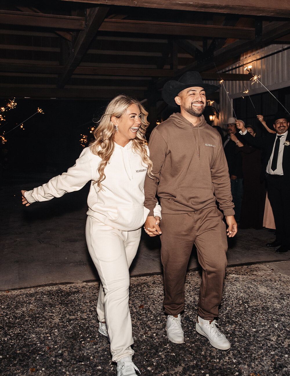 couple in sweats leaving celebration