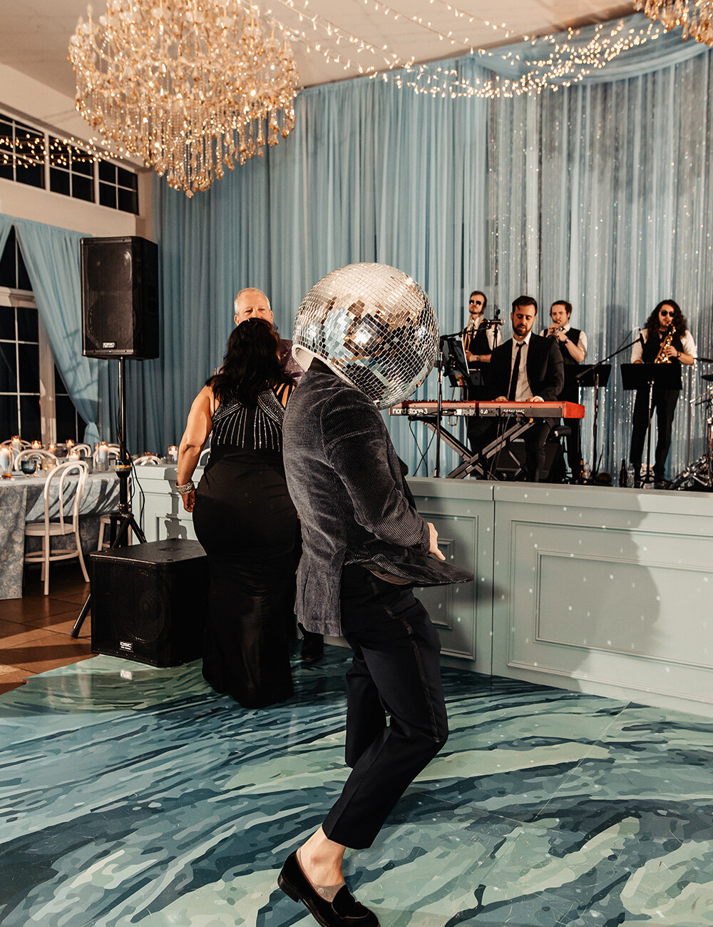 man with disco ball on head