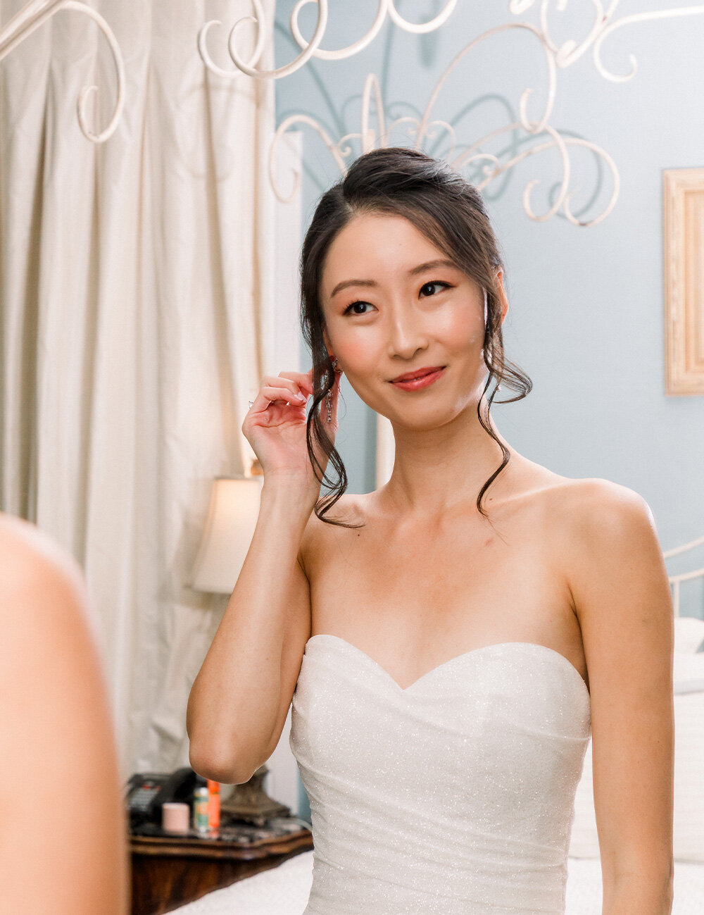 bride smiling in mirror