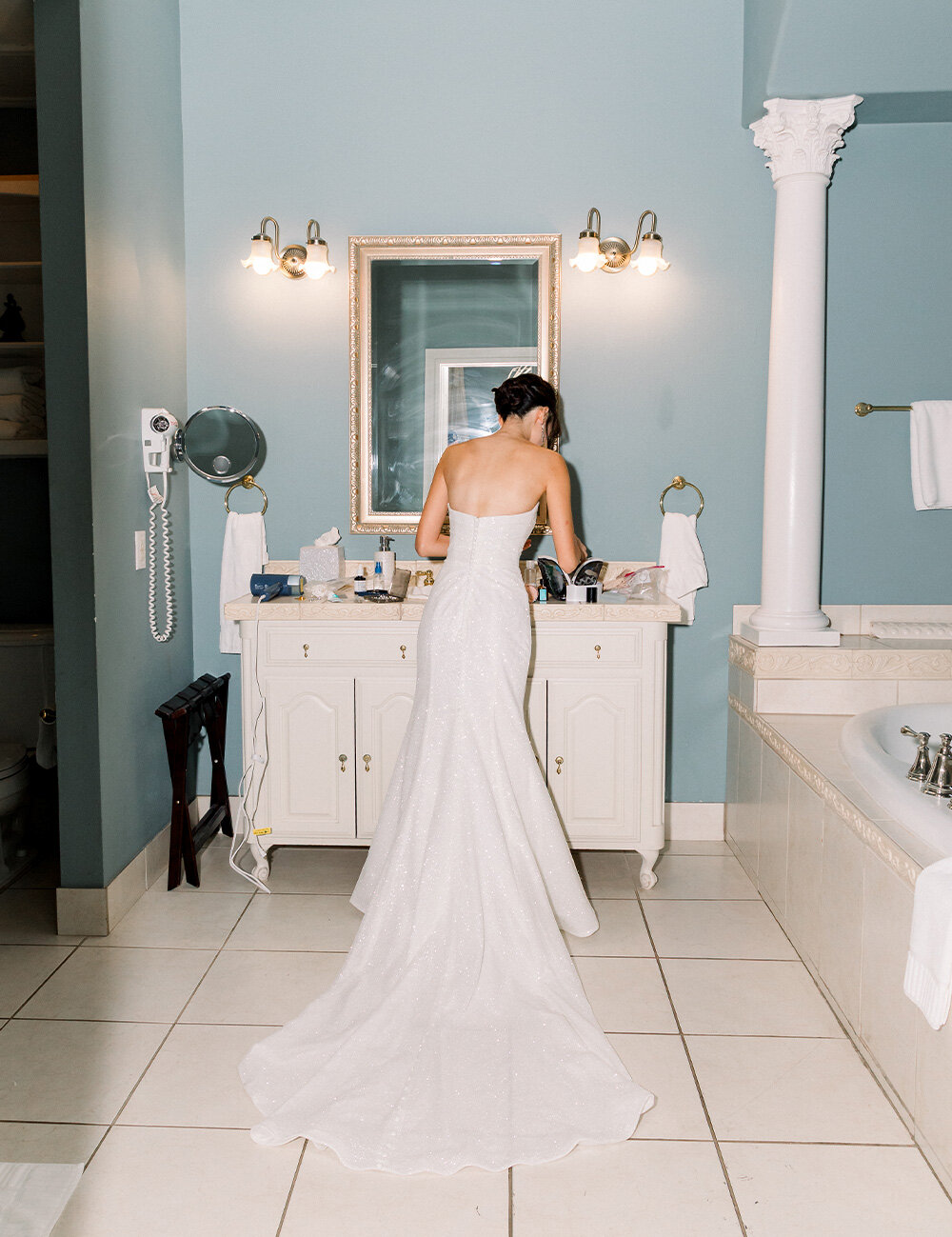 bride at sink showing back of dress