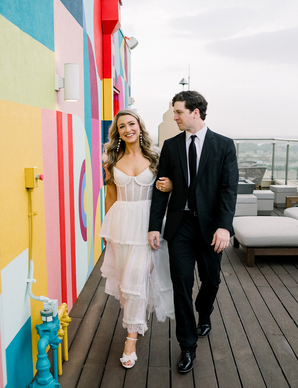 couple at colorful wall