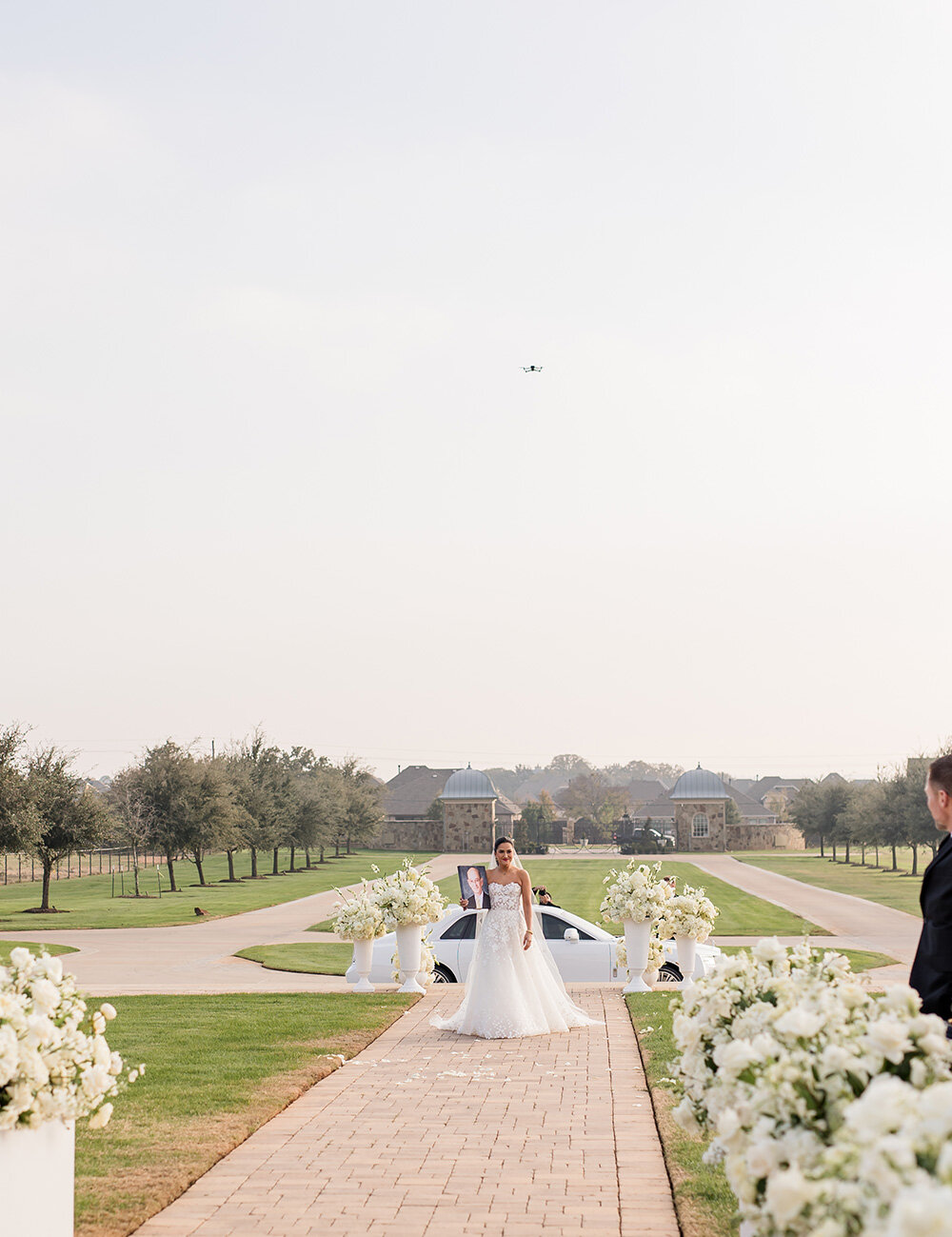 outside bride with car