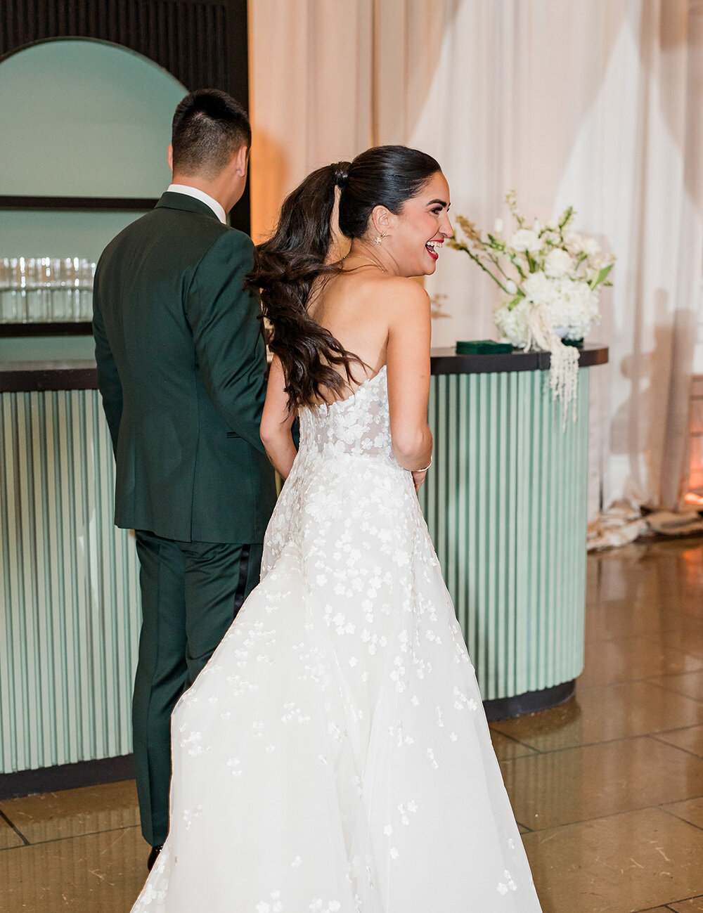 couple smiling into reception space