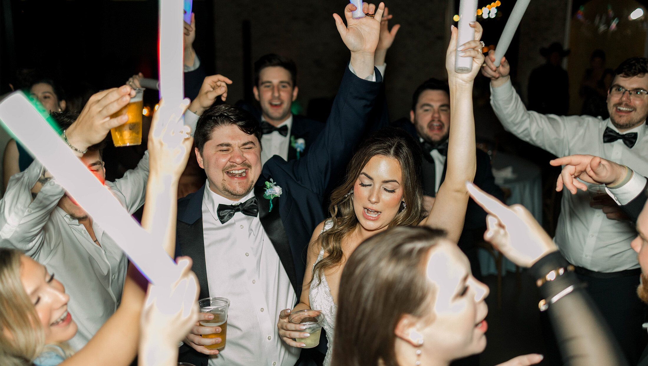 couple dancing on the dance floor with everyone
