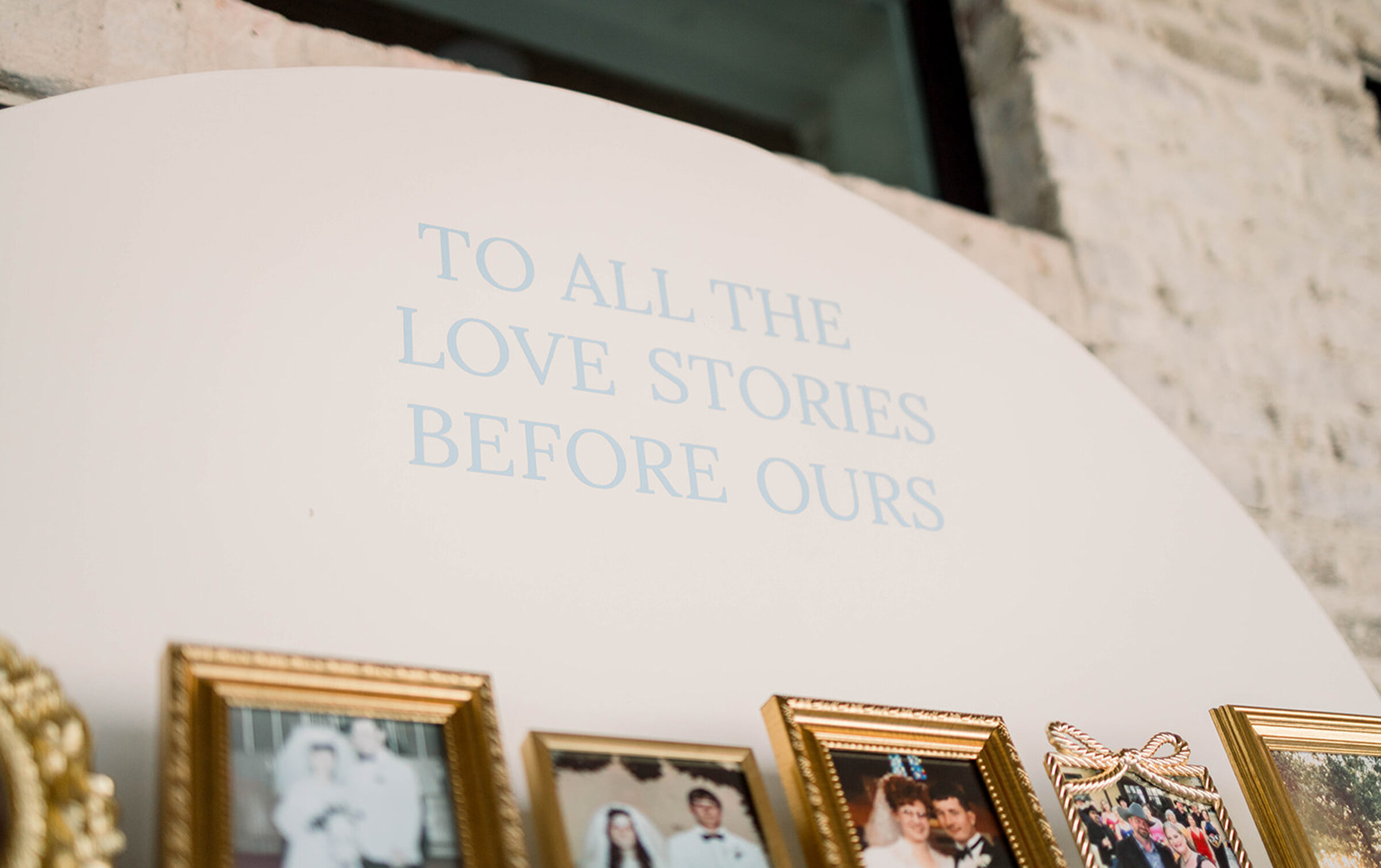 picture frames of couples on a wall