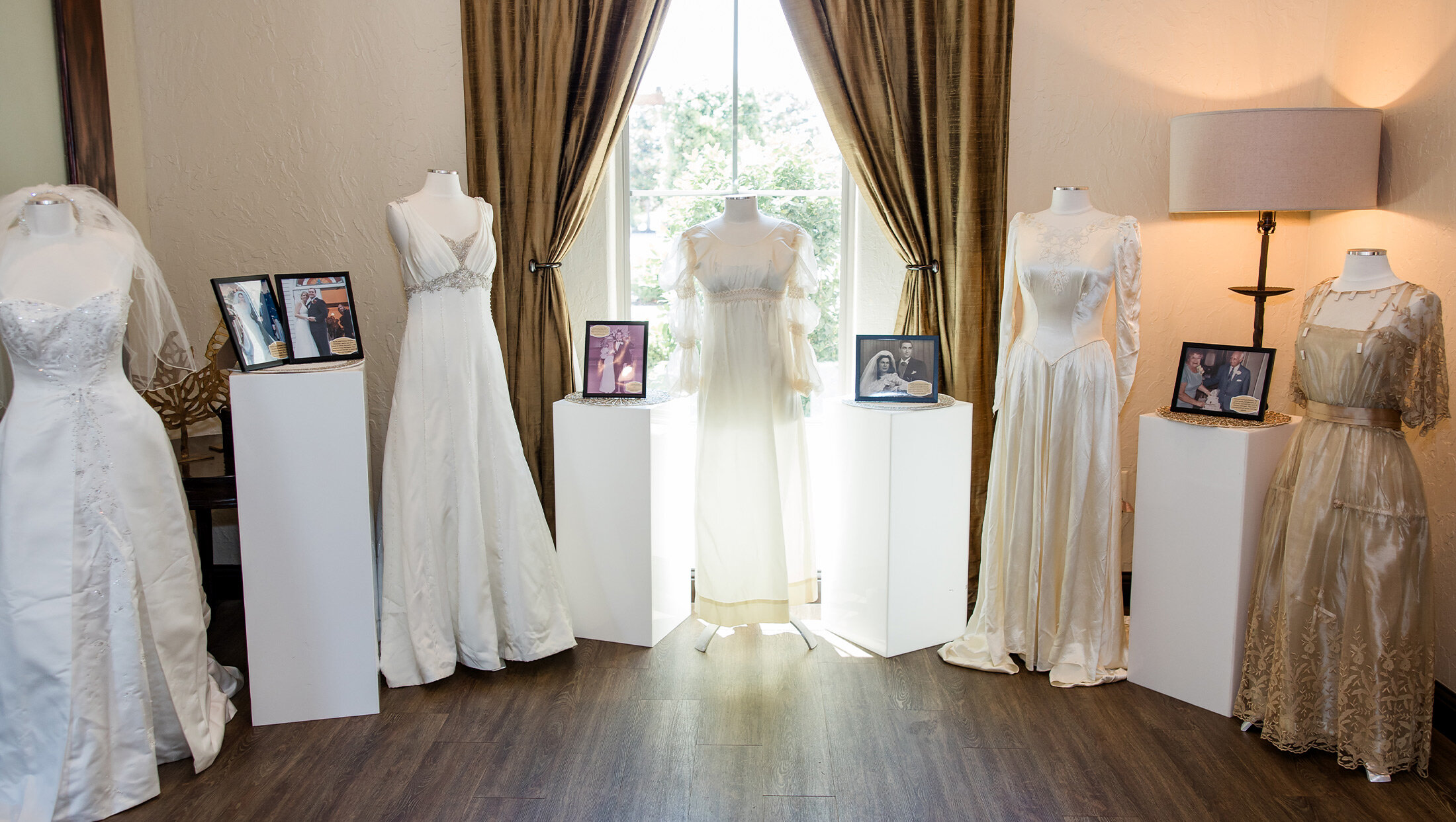 room full of bridal dresses