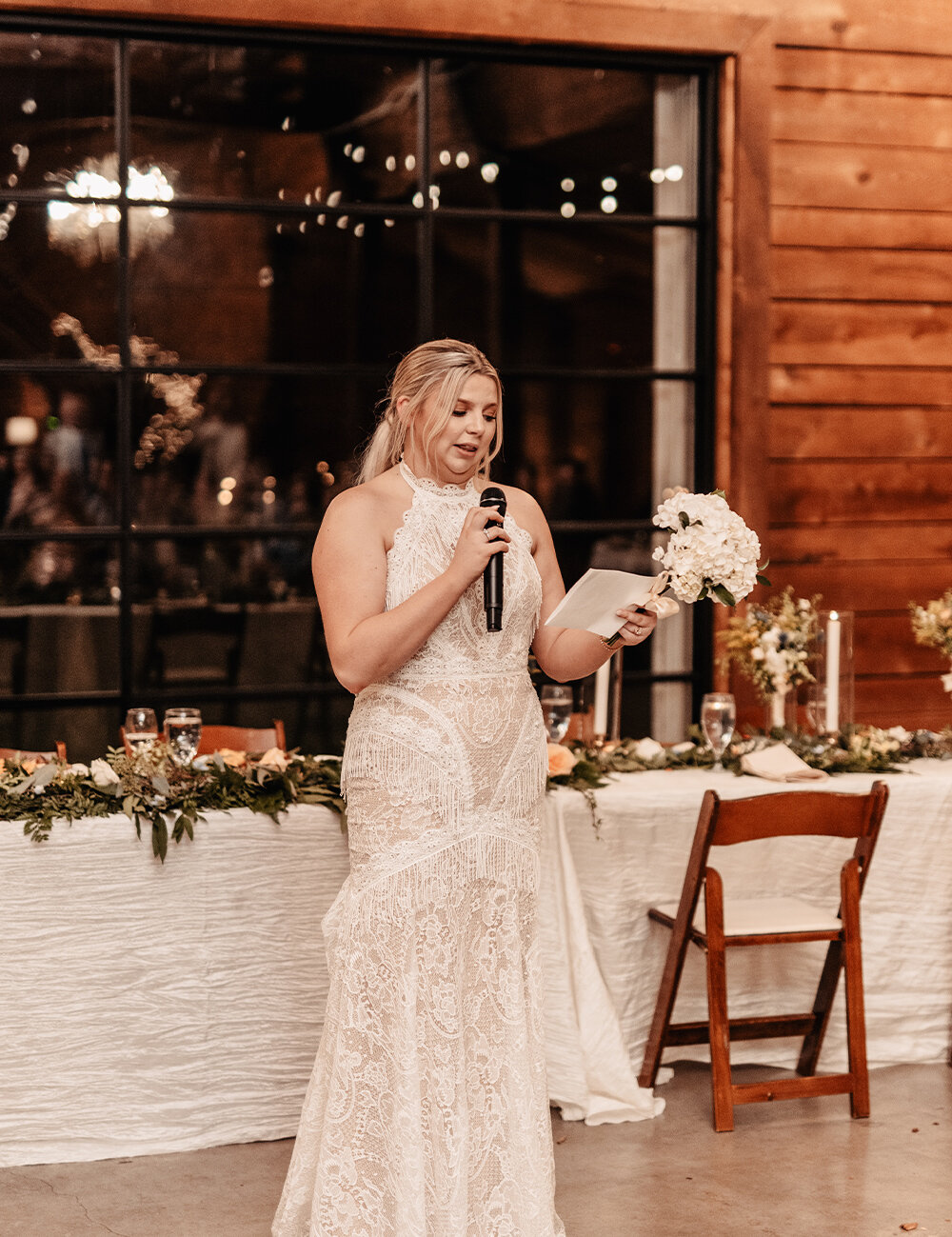 bride holding bouquet making a speech