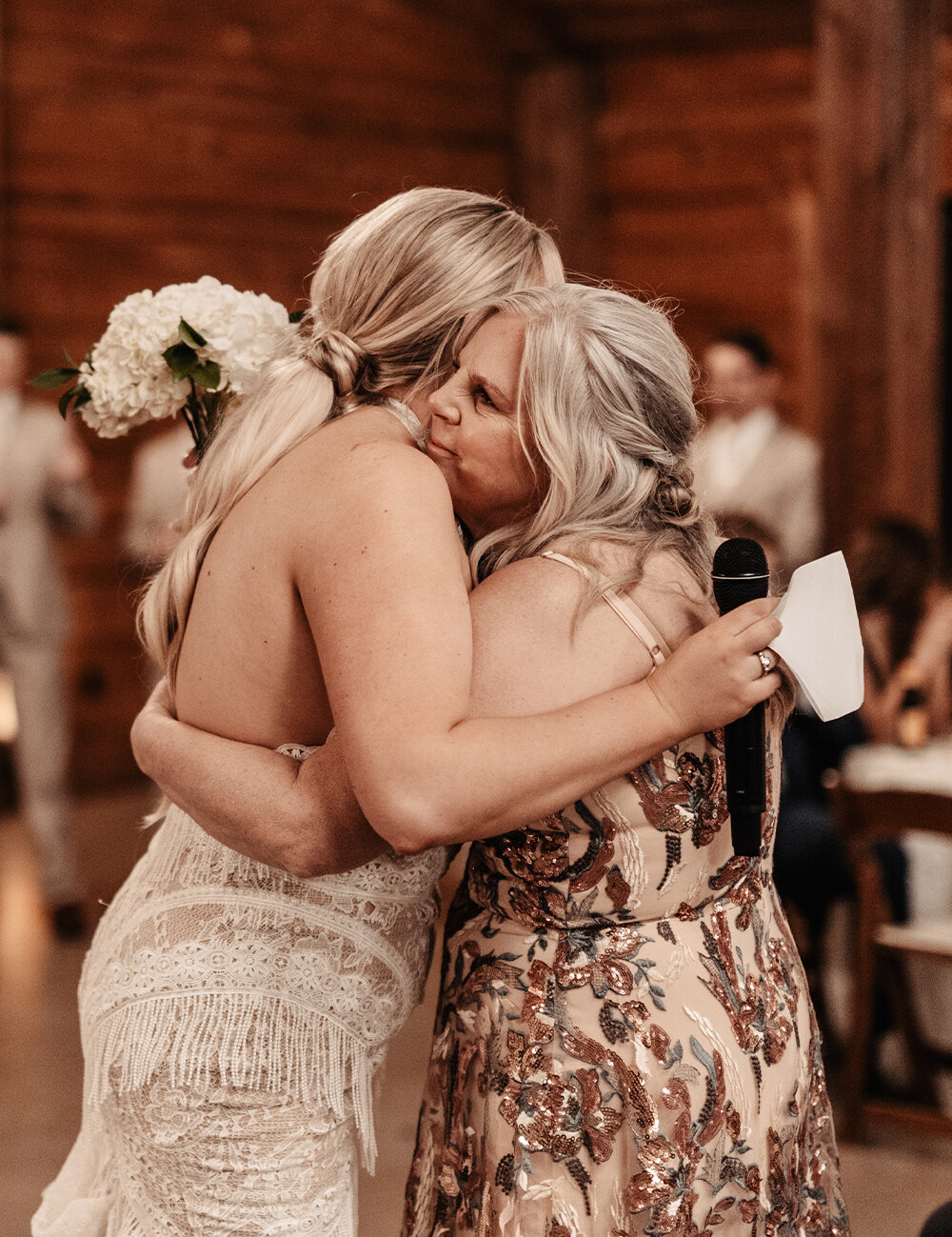 bride and mother hugging