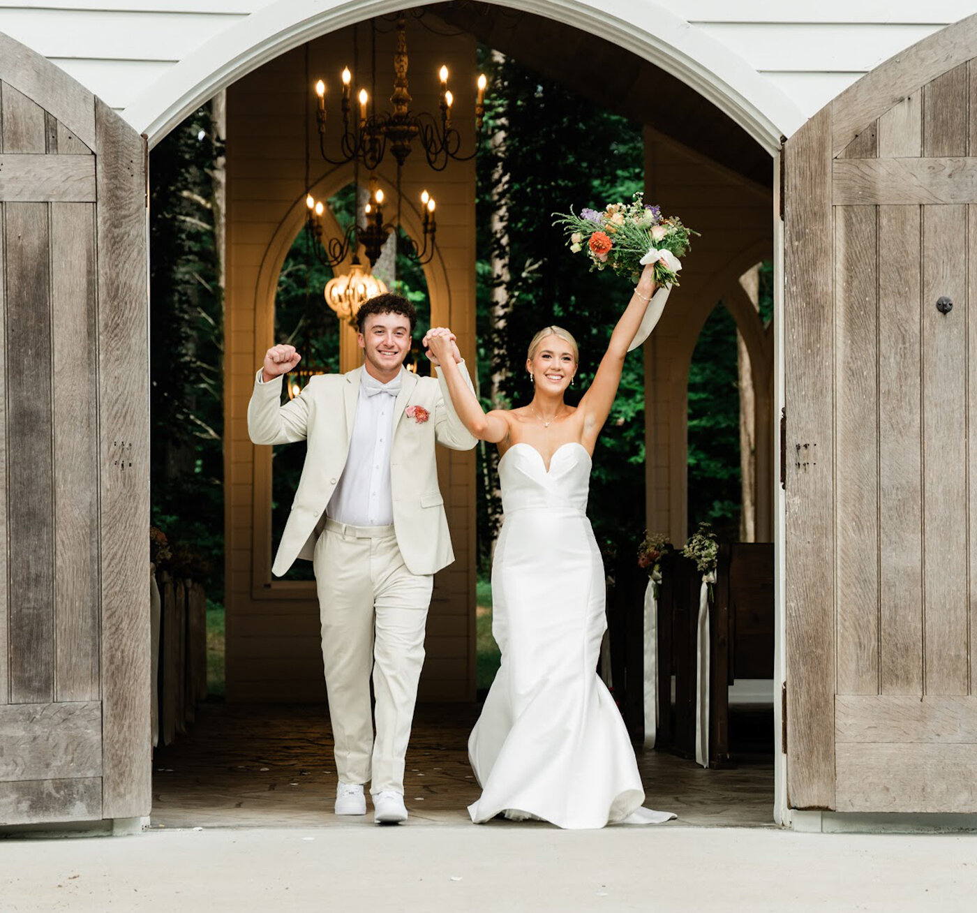 Bride and groom celebrating walking out of chapel