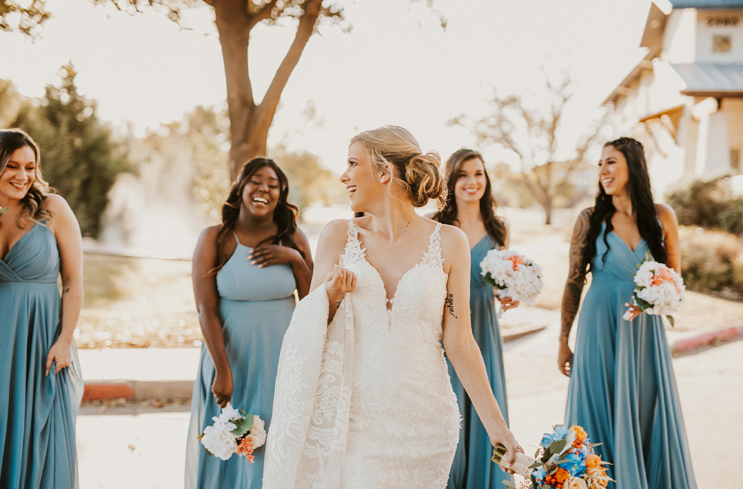 bridal party laughing outside