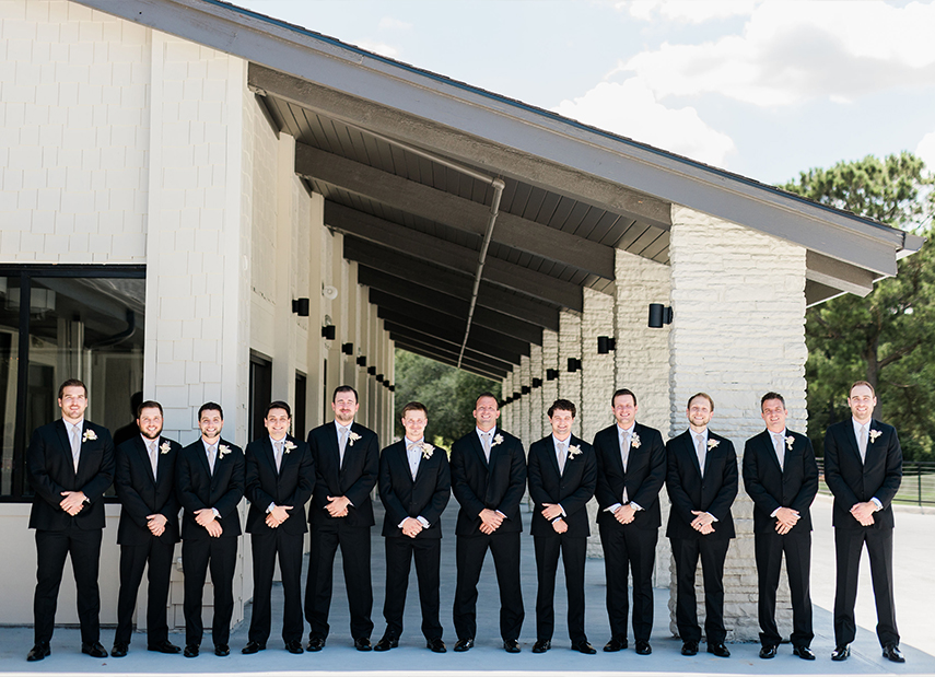Groomsmen Side by Side Exterior White Brick Building