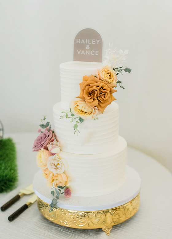 Rustic White Frosting Wedding Cake Orange Floral Detail