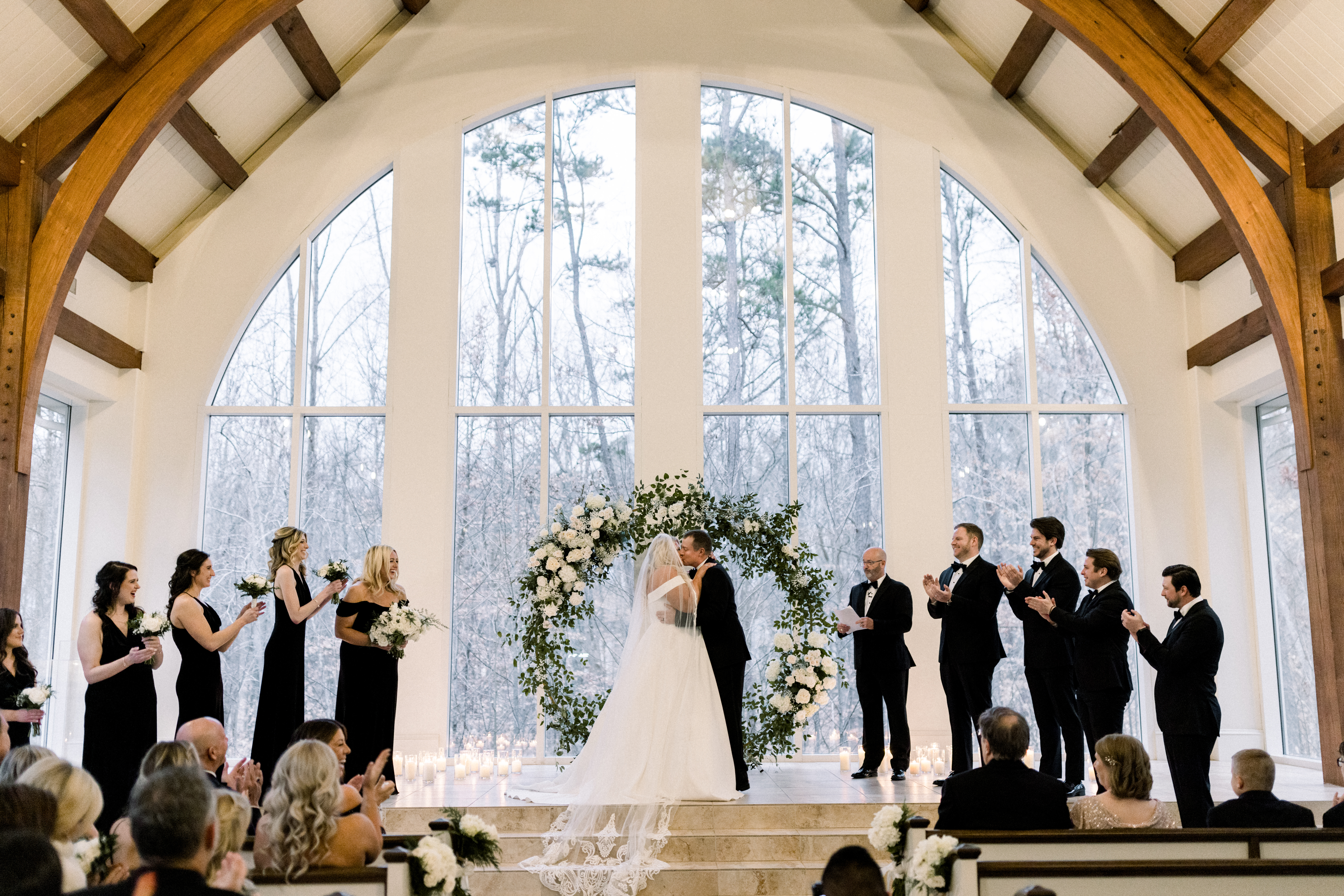 Bride and groom officially married with floral arch