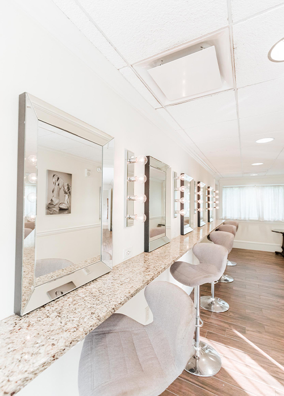 bridal suite suite vanity with mirrors and swivel chairs