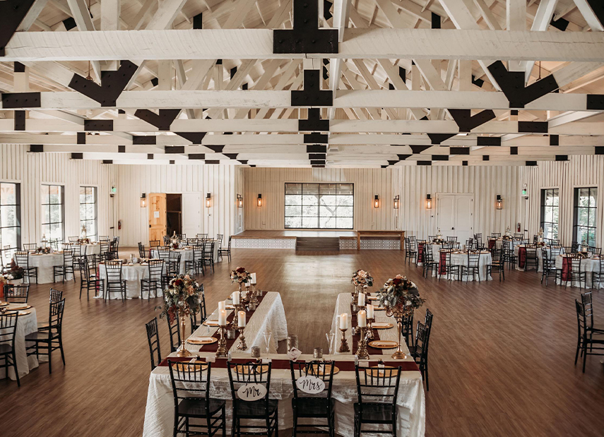 Large reception space with tables and place settings