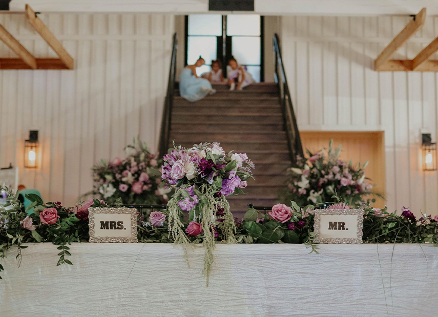 Reception Stairs with Long Table Purple Flower Decor