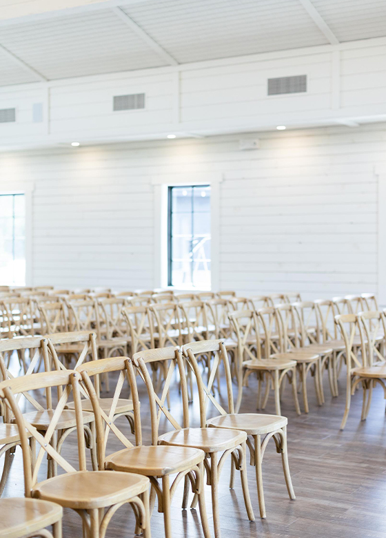 wooden chairs in ceremony space