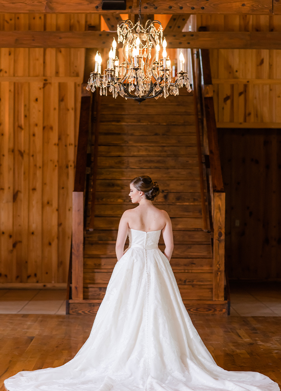 bride inside under chandelier