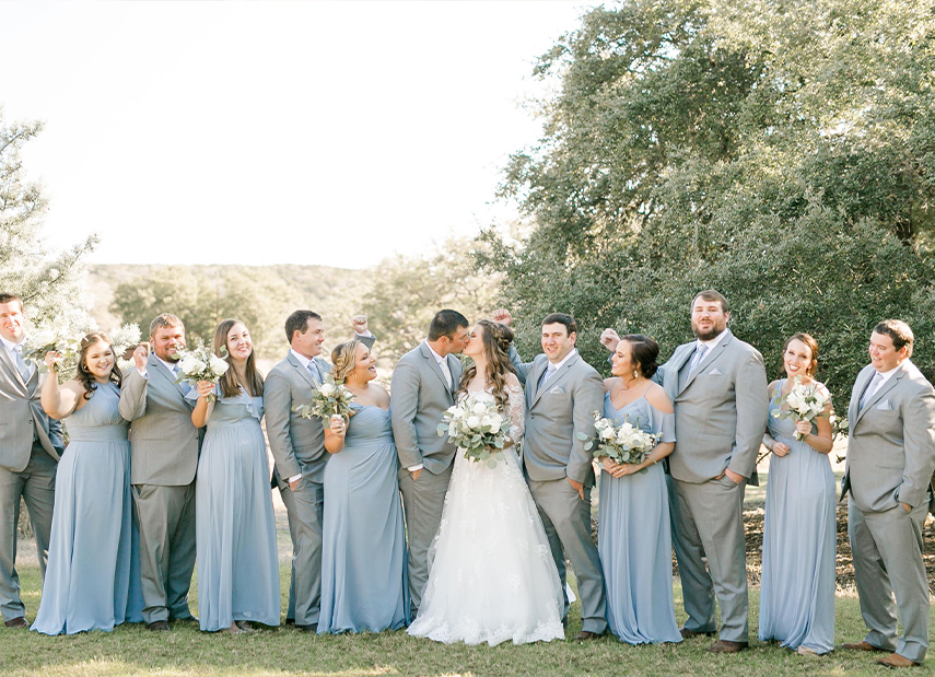 New Bride and Groom Pose with Wedding Party Outdoor Landscape