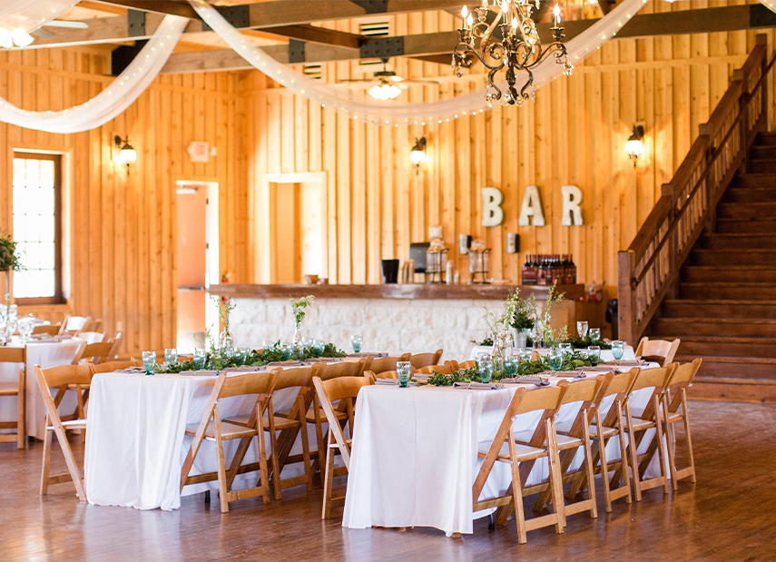 Reception Setting Long Tables Wood Chairs Rustic Walls