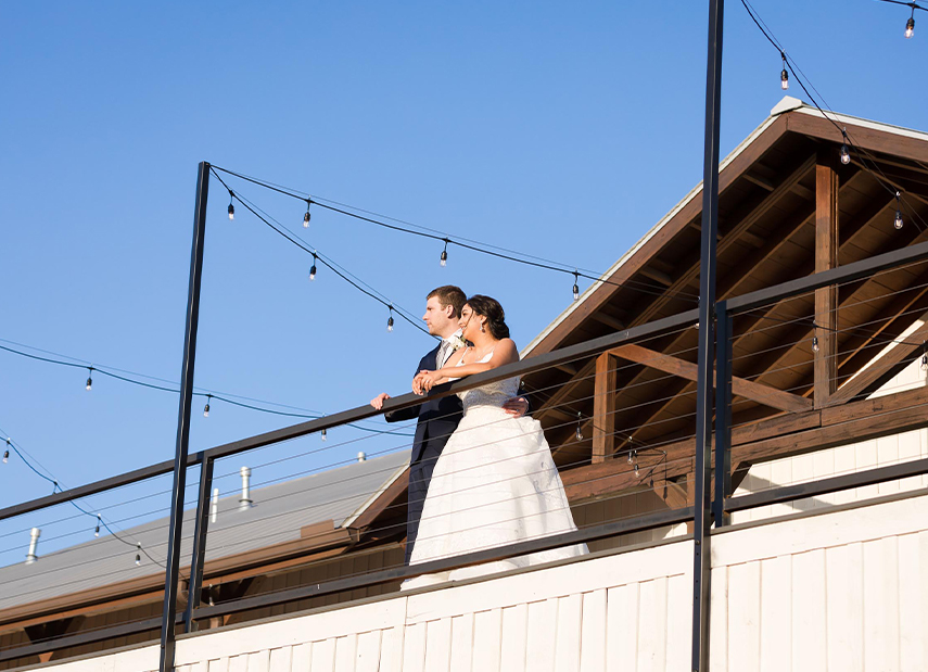 couple standing on balcony