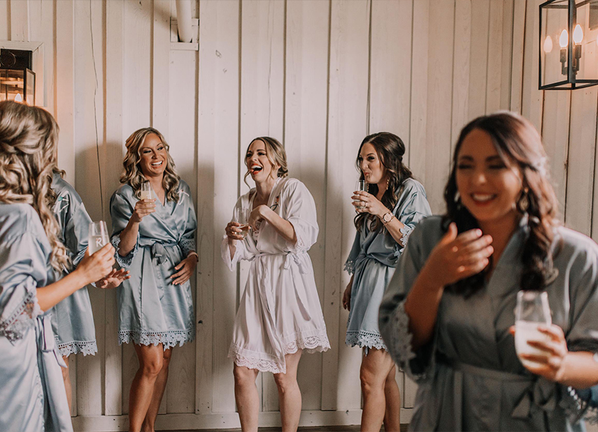 Bride and Bridesmaids Getting Ready Satin Robes White Panel Walls