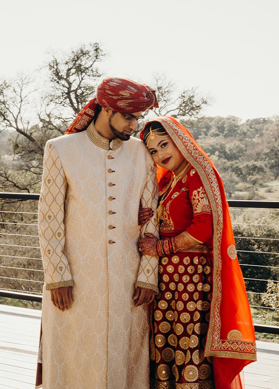 South Asian Bride Groom in Red and Ivory Garments