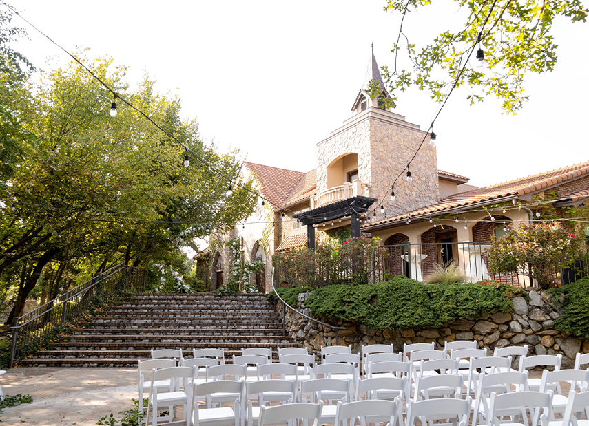 Outdoor ceremony set up with view of turret in the background