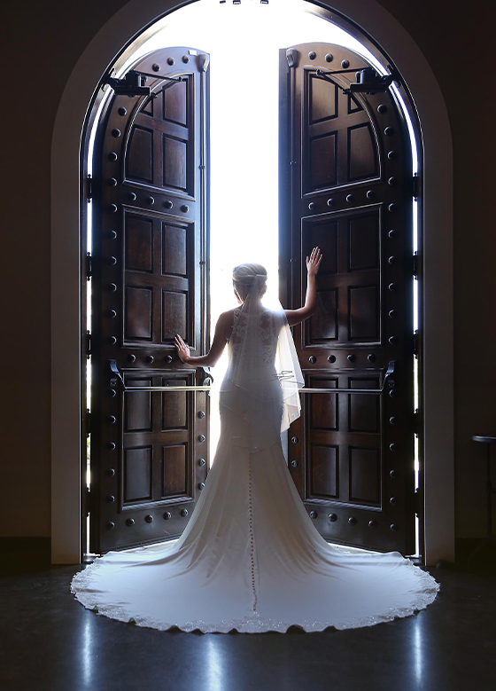 bride opening big doors