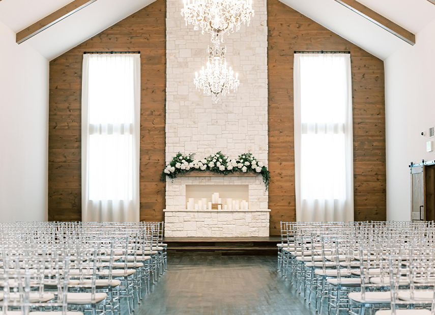 View up aisle of modern white and wood chapel