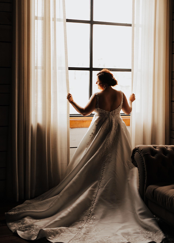 bride looking out windows
