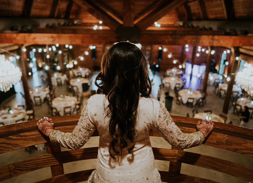 bride looking over reception area