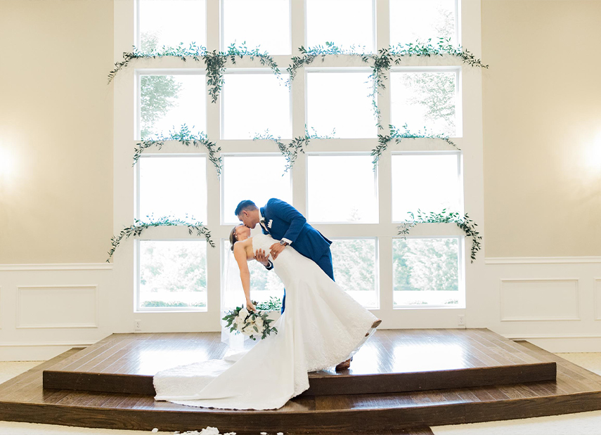 Bride and Groom Kissing Wedding Ceremony Large Windows