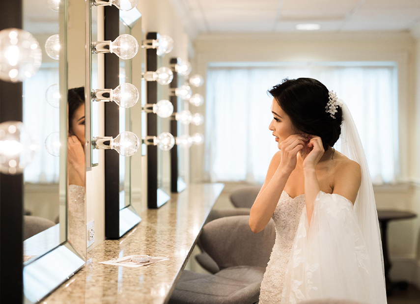 Bride in chapel bridal suite getting ready for wedding