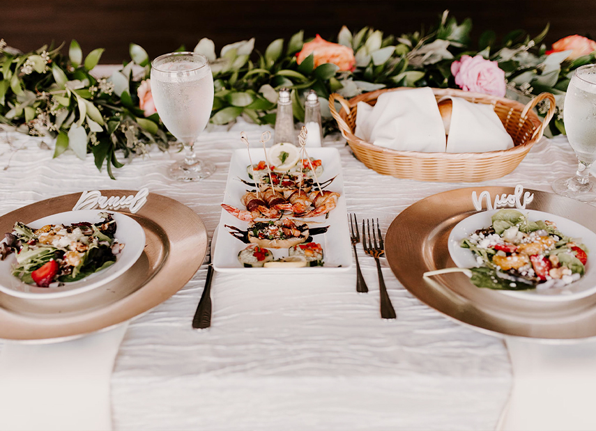 Close up of meals on sweetheart table
