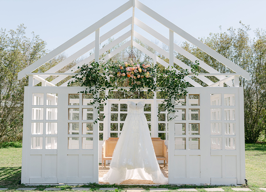The Carriage House Outdoor White Conservatory Wedding Dress Hanging