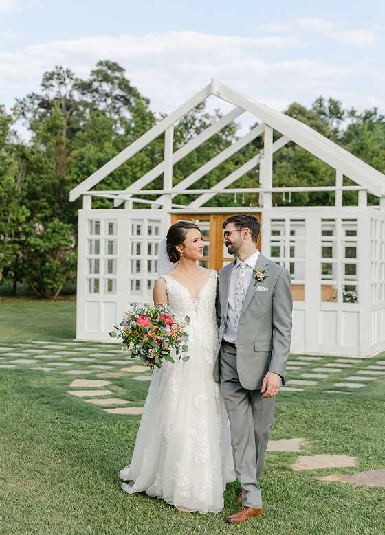 Bride Groom Embrace Pink Bridal Bouquet White Outdoor Conservatory