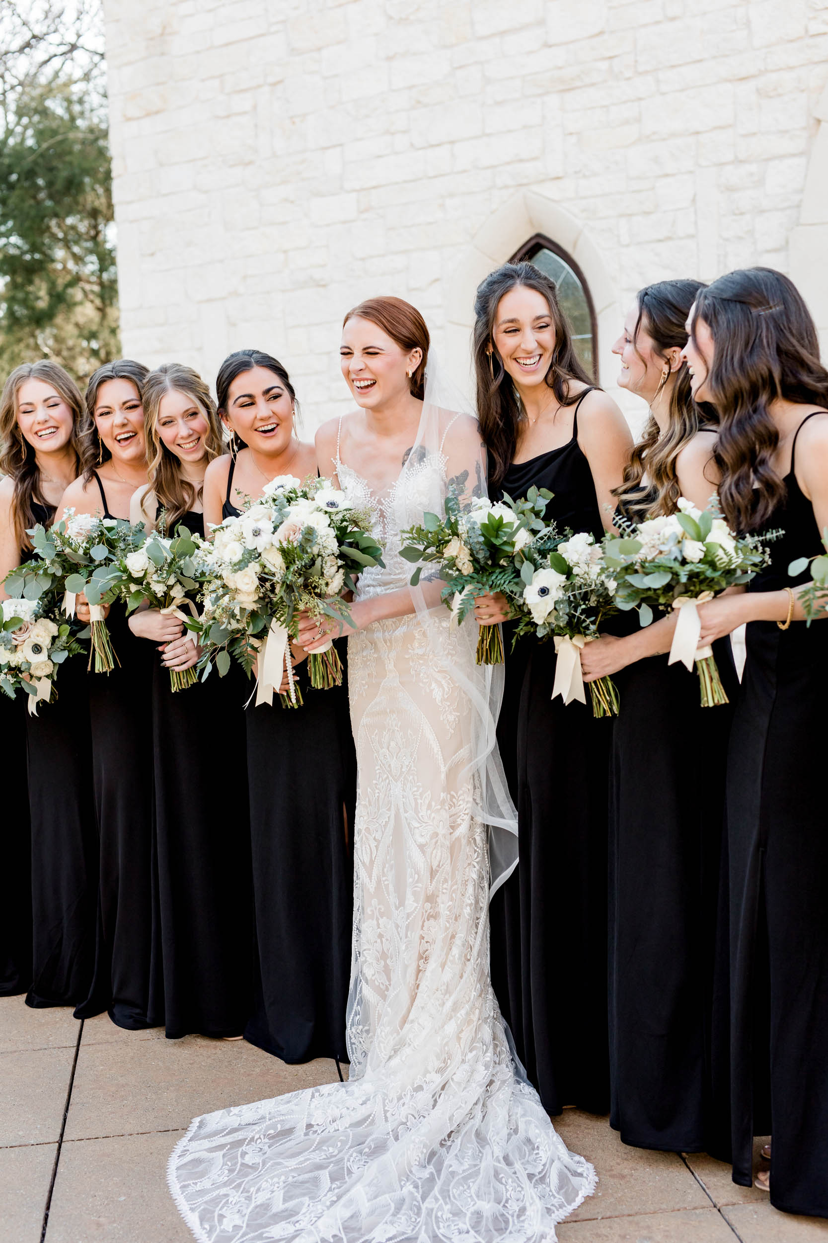 Bride and Bridesmaids Smiling Posed Outside Ceremony Chapel